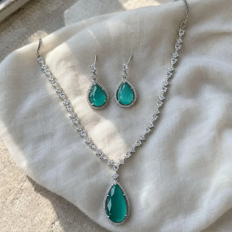 Teal teardrop CZ necklace and earring set from SBN India